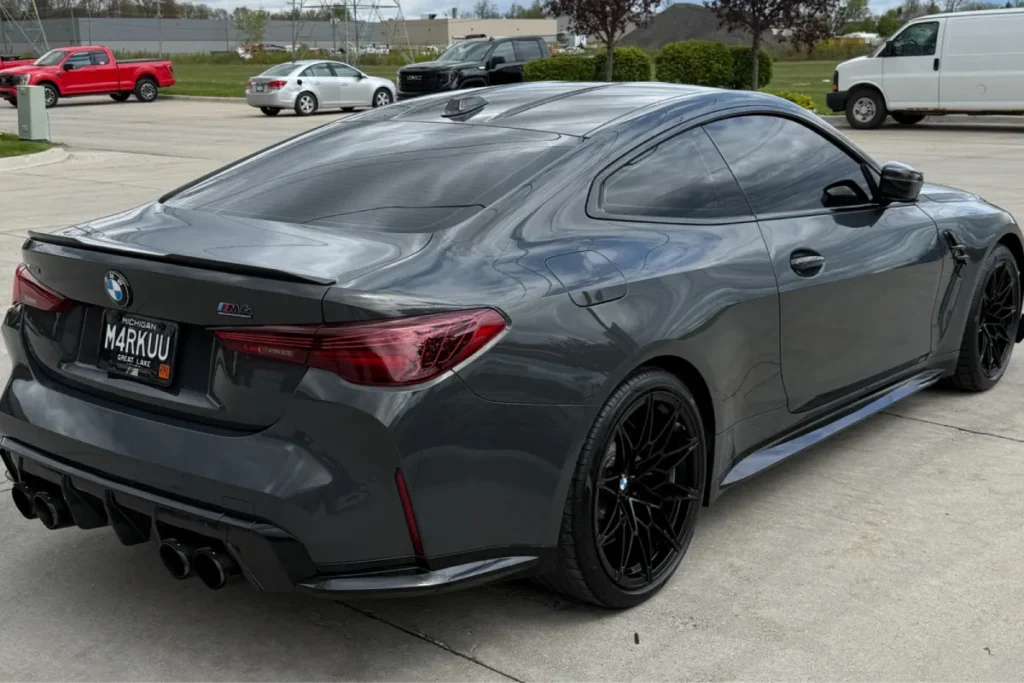 Rear view of a gray BMW with a glossy ceramic coating finish.