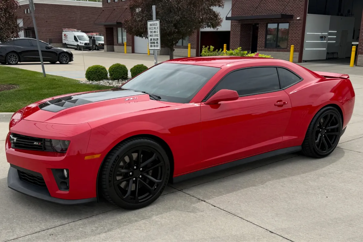 Ceramic coated red Camaro with black wheels