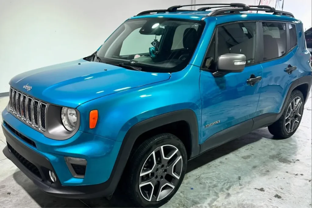 Blue Jeep SUV with glossy finish showing paint correction results outdoors