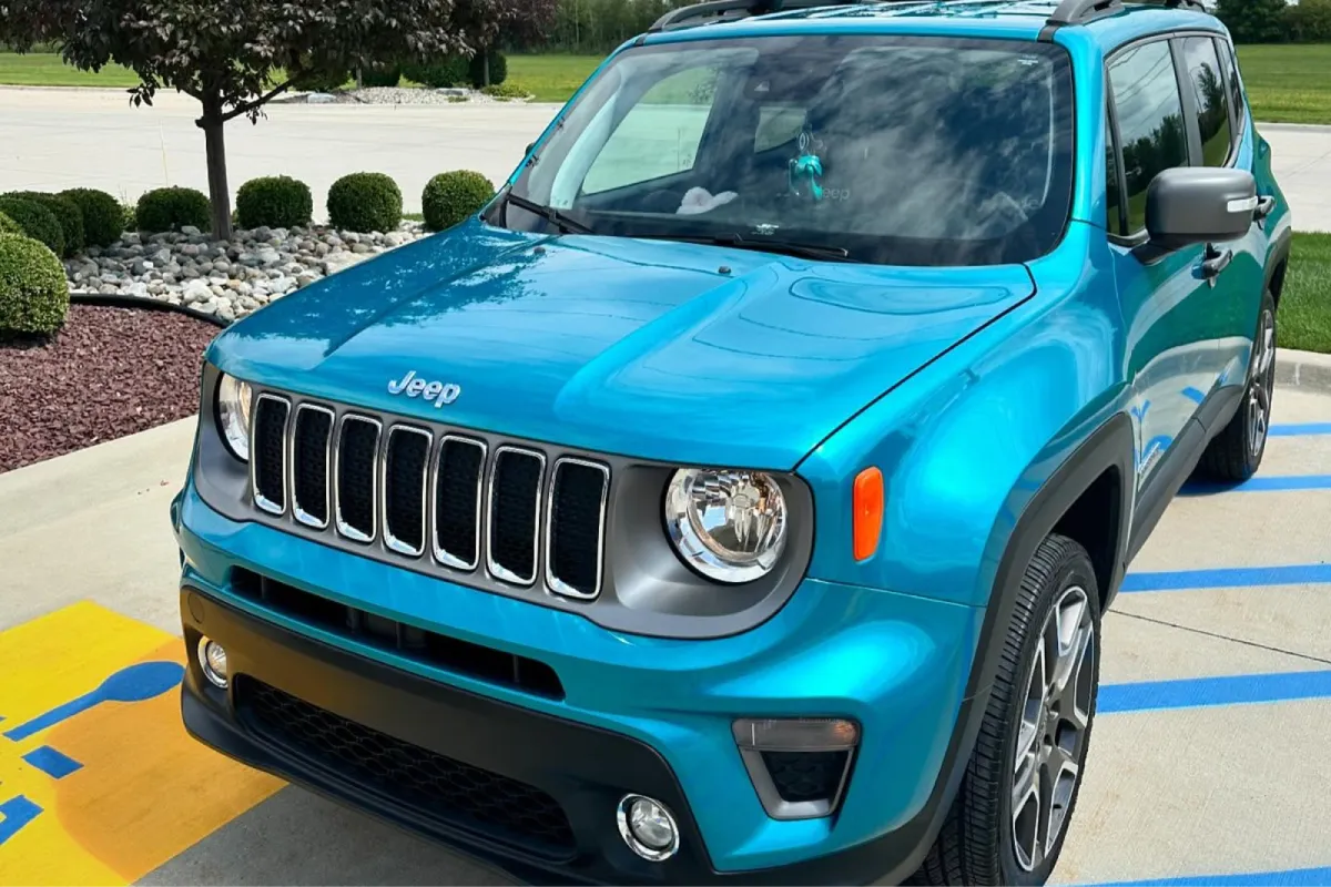 Teal Jeep Renegade exterior showing paint correction finish enhancement.