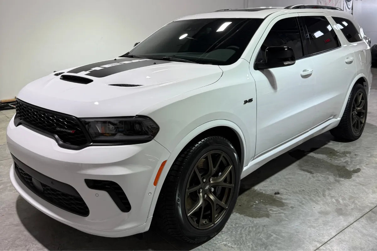 White Dodge Durango showcasing premium automotive window tint installation.