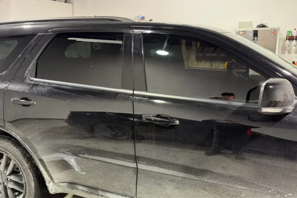 Black SUV with professionally tinted windows.
